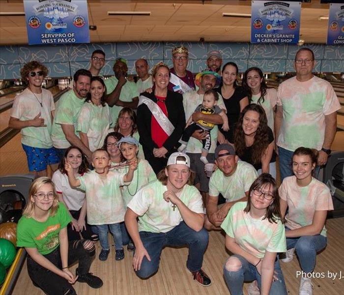 Group of People at a bowling event for charity in tie dye shirts